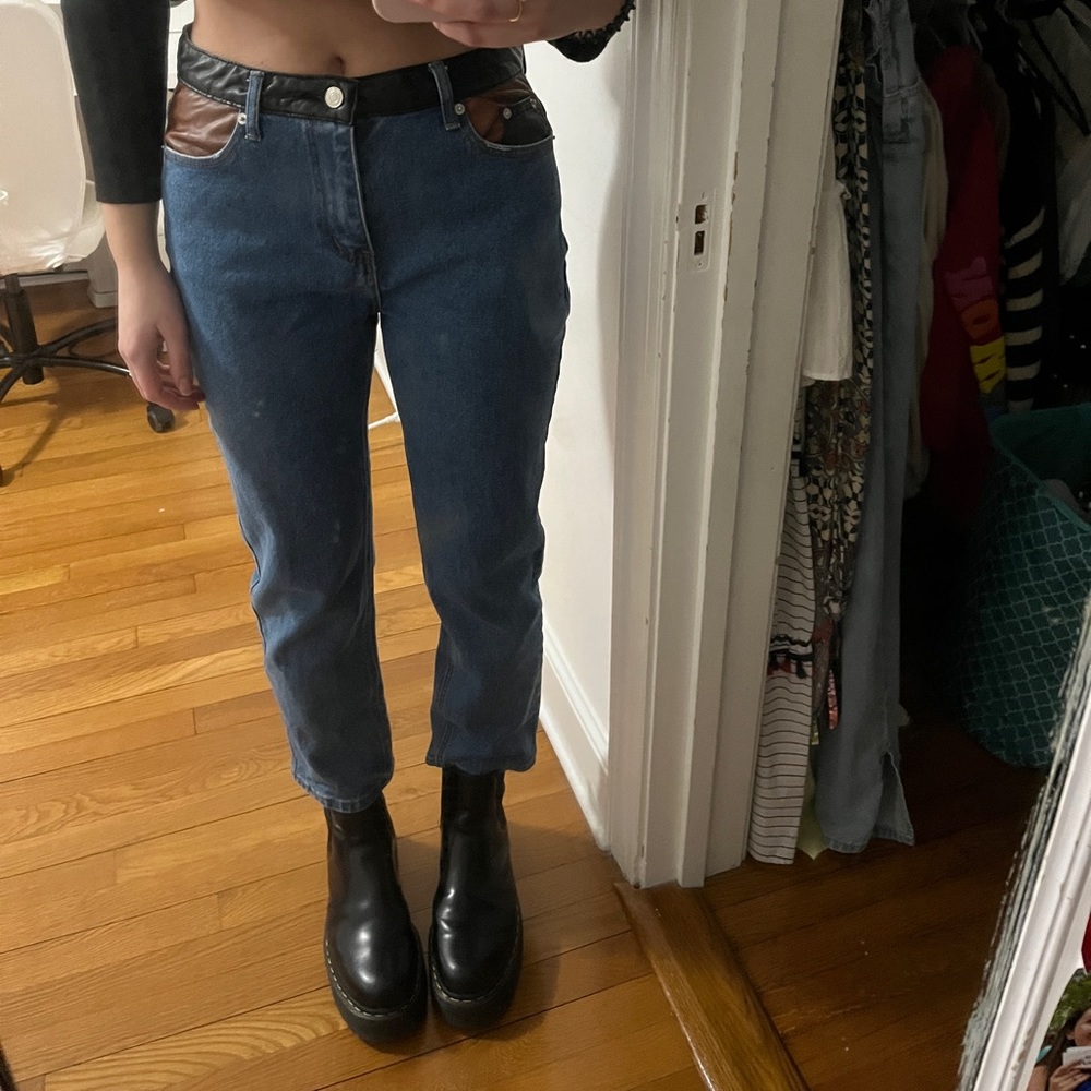 straight leg dark wash jeans with leather pockets and belt rim
